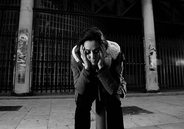 istock woman alone on street suffering depression looking sad desperate 498687788