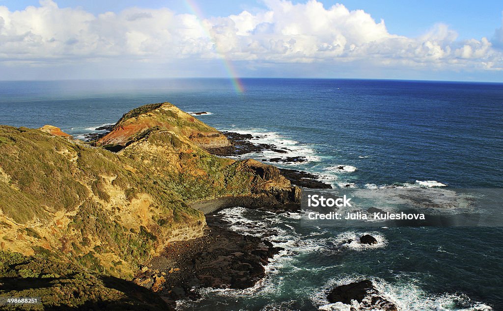 Rainbow on an ocean Amazing rainbow in a sunny day on the Southern Ocean, Bass Strait, Australia Coastline Stock Photo