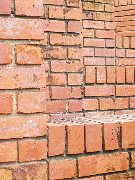 istock Old grunge brick wall background in orange 498688421