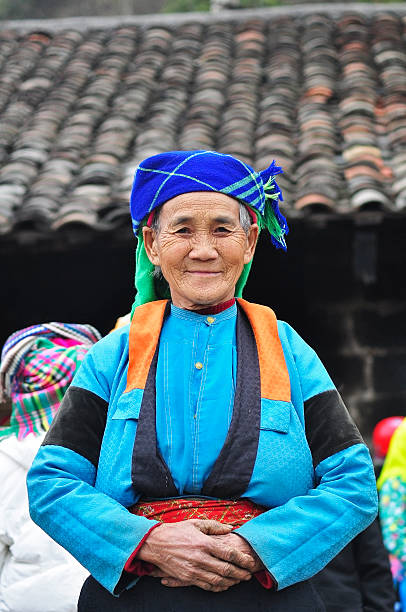 H'mong's portrait Ha Giang, Viet Nam - February 19, 2012: Unidentified women of the Flower H'mong ethnic minority People at market in Hagiang, Vietnam. There are about 800,000 thousand H'mongs in Vietnam. bac ha market stock pictures, royalty-free photos & images