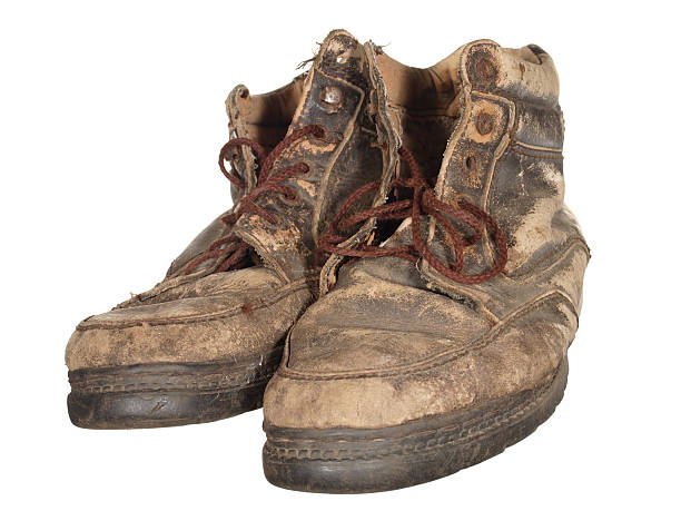 istock The old worn out boots with brown laces 498689596