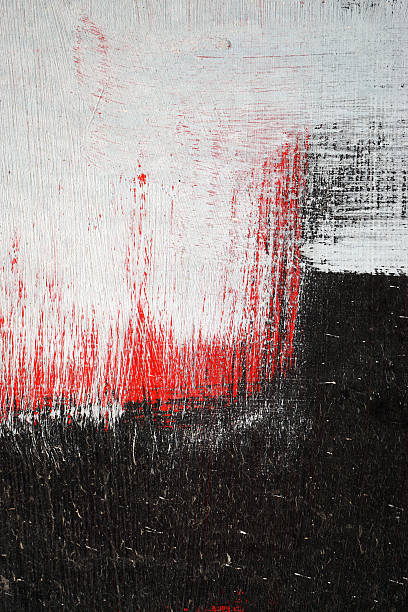 istock Brushstroke with white,black and red paint  on dusty metal 498693780