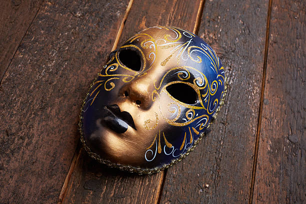 istock Venetian mask on a wooden table 498694642