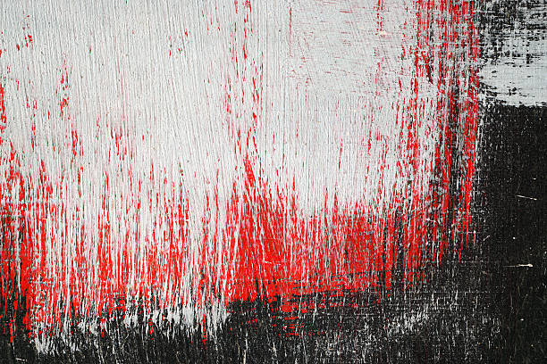 istock Brushstroke with white,black and red paint  on dusty metal 498694694