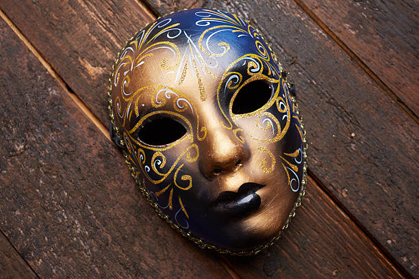 istock Venetian mask on a wooden table 498694696