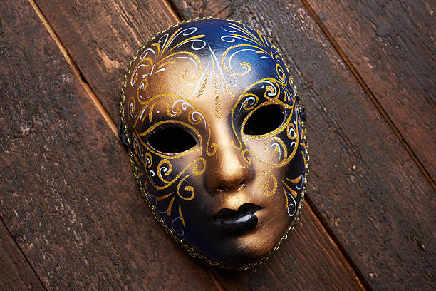 istock Venetian mask on a wooden table 498694886