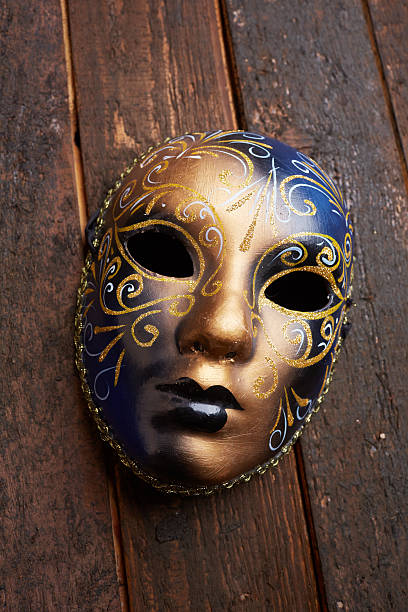 istock Venetian mask on a wooden table 498695160