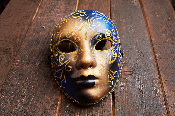 istock Venetian mask on a wooden table 498695932