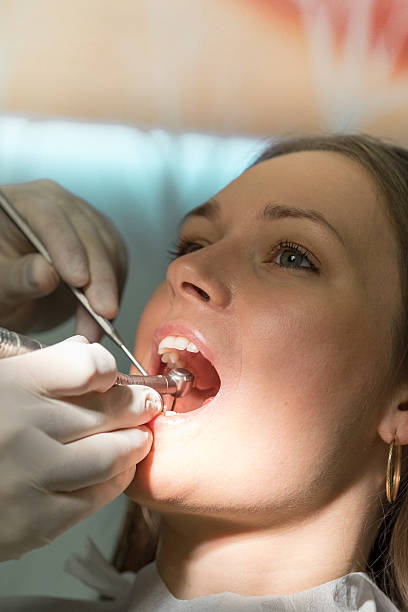istock Dentist survey dental examination close up 498696284