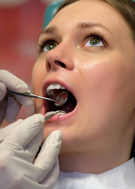 istock Dentist survey dental examination close up 498696478