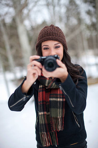 istock Cute Girl Taking Photos with Her Camera 498696608