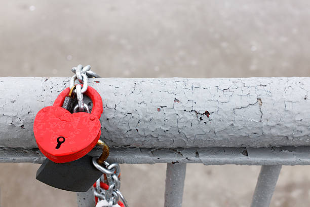 istock red lock in heart shape with drops of rain 498699004