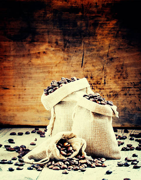 Grains of roasted coffee in bags