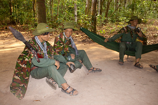 Cu Chi, Vietnam - July 26, 2012: Figurines  of Viet Cong warriors. The Cu Chi tunnels were the Viet Cong's base of operations for the Tet Offensive in 1968.