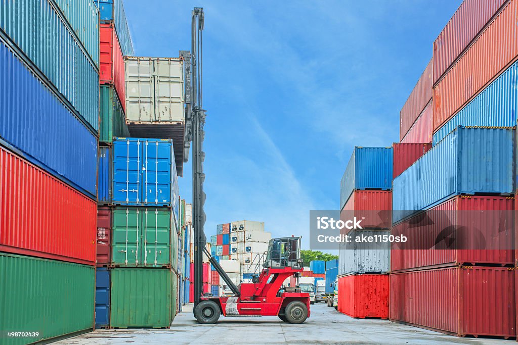 Crane lifter handling container box loading to truck in import Crane lifter handling container box loading to truck in import export logustic zone Customs Official Stock Photo