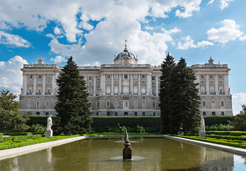Madrid, Spain - April 17, 2014: Side view of the Royal Palace of Madrid (Palacio Real) as seen from the Sabatini Gardens. This palace is the official residence of the Spanish Royal Family at the city of Madrid, but it is only used for state ceremonies.