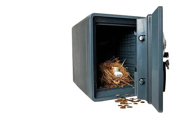 Picture of Isolated Fireproof Safe On White Background With Coins, Money, 401K Retirement Planning Nest Egg Inside Vault That is Safe and Secure