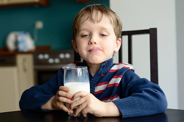 menino com copo de leite delicious - milk mustache imagens e fotografias de stock