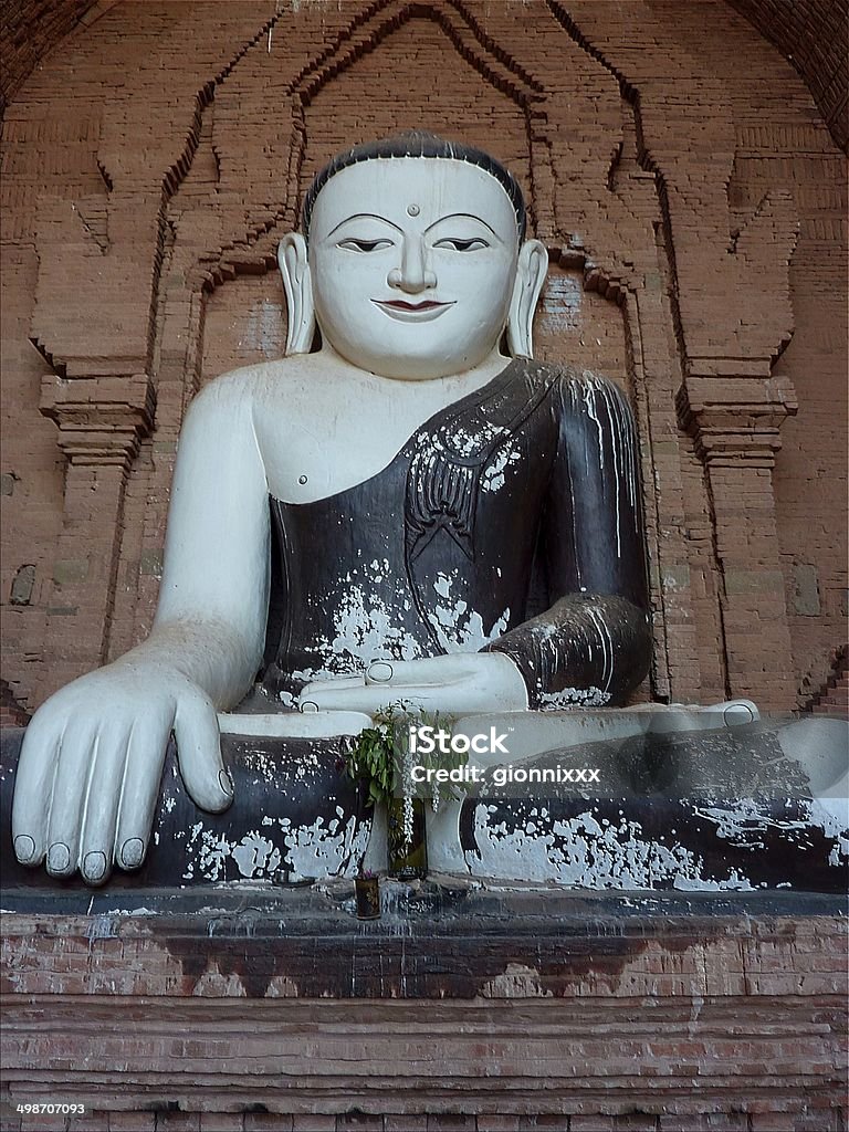 Croos legged Buddha, Pyathadar Temple, Bagan Pyathadar Temple crooss legged Buddha statue. It is a double-cave type monument in Bagan plain. This monastery has Indian influence and have large terrace to see the wonderful sunset in Bagan. Architectural Feature Stock Photo