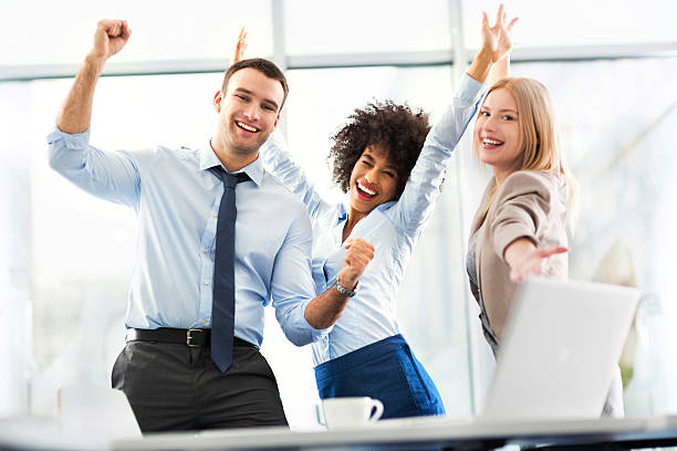 istock Business people cheering with arms raised 498708652