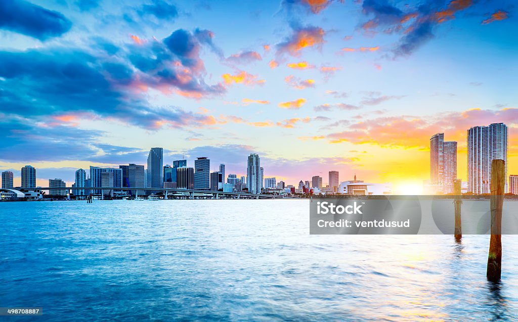 Miami city by night Miami city skyline panorama at dusk with urban skyscrapers over sea with reflection Bay of Water Stock Photo