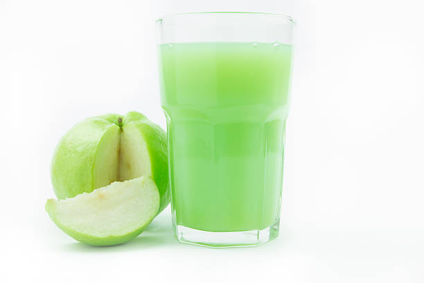 istock Fresh guavas and guava juice on white 498708907