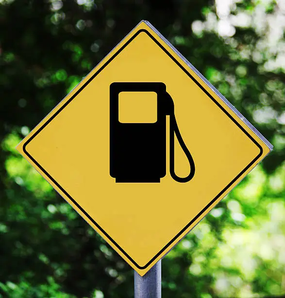 Yellow traffic label with petrol station pictogram