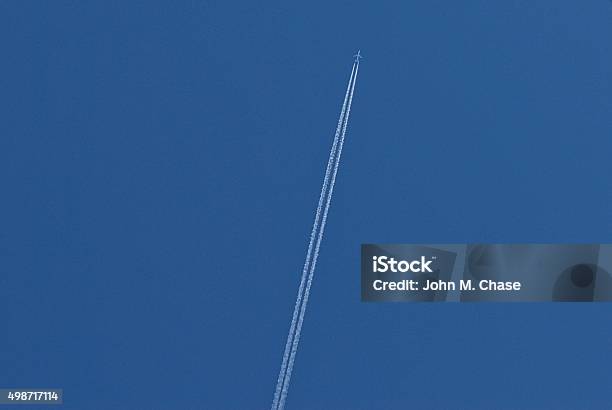 Twoengine Airplane With Contrail Stock Photo - Download Image Now - 2015, Aerospace Industry, Airplane