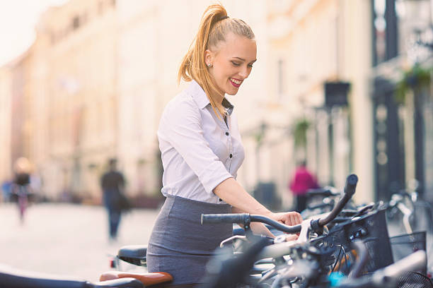 istock Young woman parking her bicycle 498717256