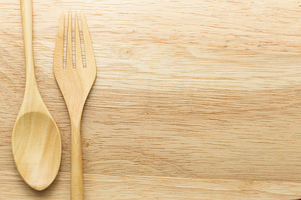 istock Wooden spoon and fork on wood background 498719182