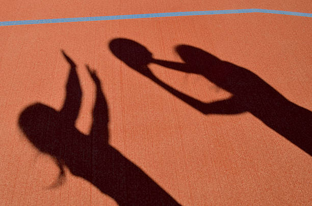 istock Ball Players playing netball 498719900