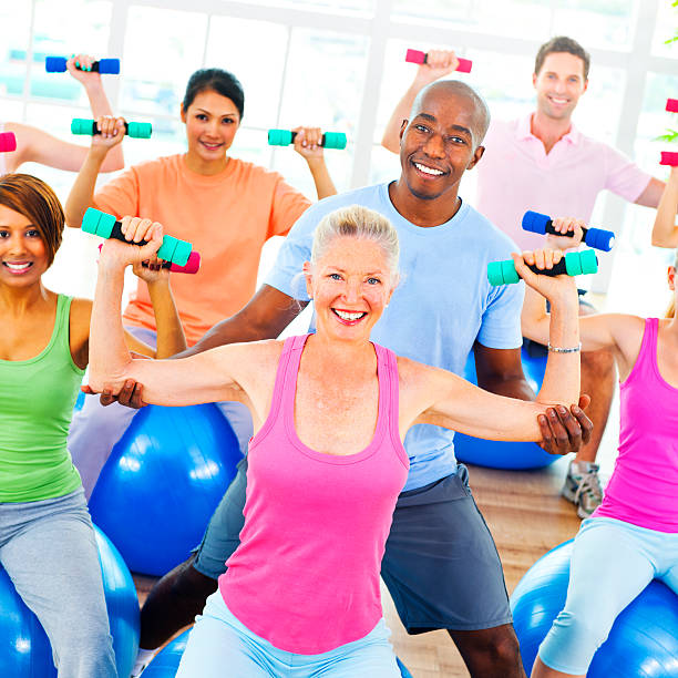 istock Diversity People Healthy Fitness Weights Training Concept 498720636