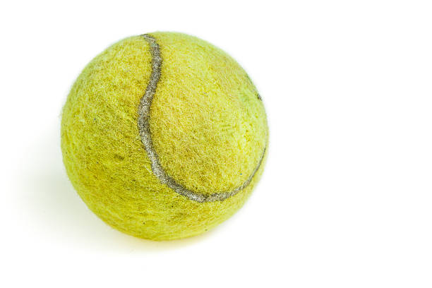 istock Old tennis ball isolated 498721710