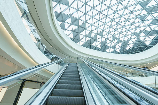 istock abstract ceiling and escalator in hall of shopping mall 498722890
