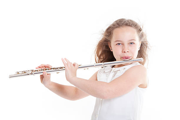 istock young  girl playing flute 498730689