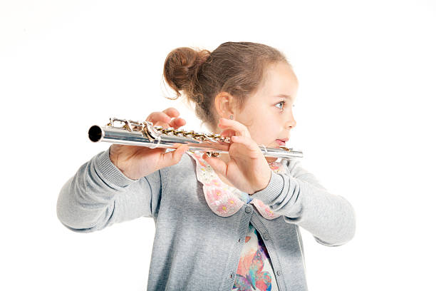 istock young  girl playing flute 498730789