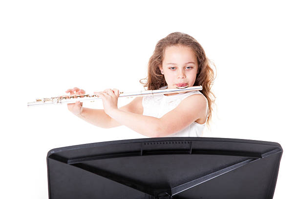istock young  girl playing flute 498730819