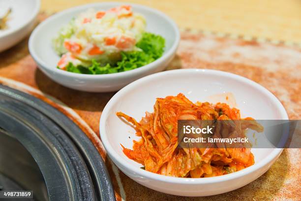 Kimchi Korea Food On The Table Beside Barbecue Stove Stock Photo - Download Image Now