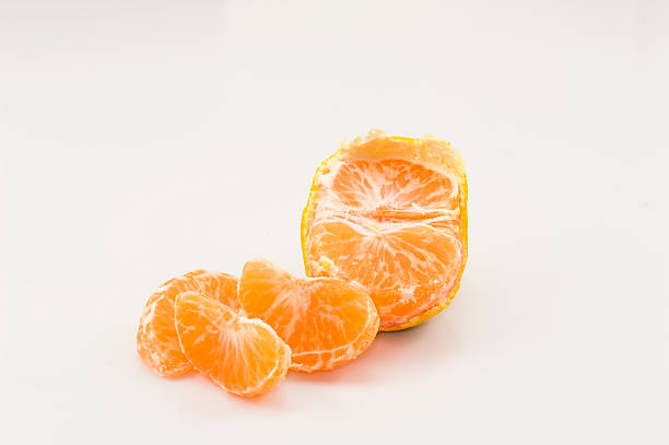 istock Slices of tangerine on the white background 498732581