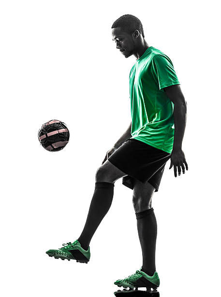 istock african man soccer player  juggling silhouette 498733217