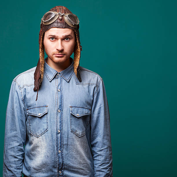 istock fashion male pilot in the studio 498734071