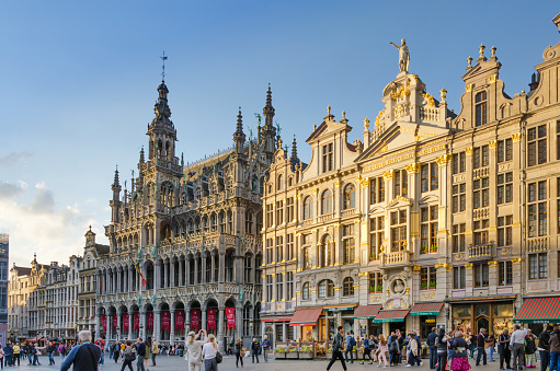 Brussels, Belgium - May 13, 2015: Many tourists visiting famous Grand Place the central square of Brussels. The square is the most important tourist destination and most memorable landmark in Brussels.
