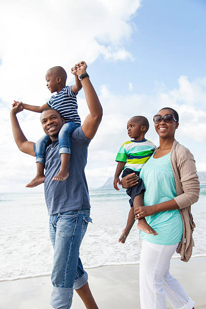 istock African family spending a day on the beach 498735939