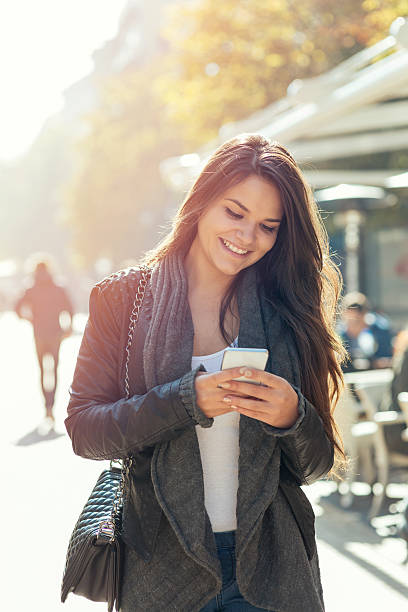 istock Girl texting on cell phone 498736716