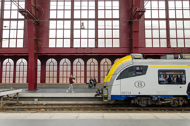 Antwerp, Belgium - May 10, 2015: People in Antwerp Central station on May 10, 2015 in Antwerp, Belgium. The station is now widely regarded as the finest example of railway architecture in Belgium.