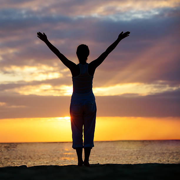istock Caucasian woman practicing yoga at seashore 498741540