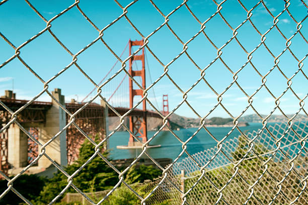 istock Golden Gate Bridge through wire fence 498744390