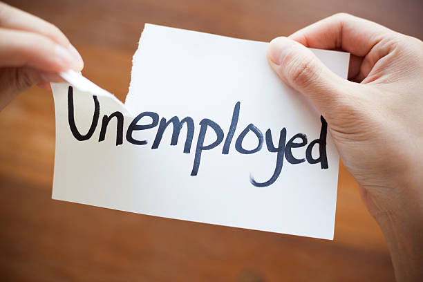 istock Hands Tearing Paper with the Words - Unemployed become Employed 498744776