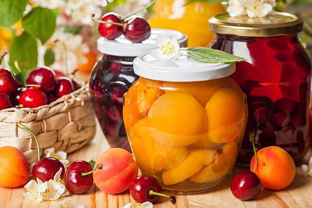 Preserved  fruit and berries Jars of homemade fruit preserves preserved stock pictures, royalty-free photos & images
