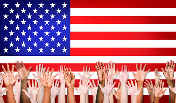 istock Group Of Multiethnic Arms Outstretched With North American Flag 498750199